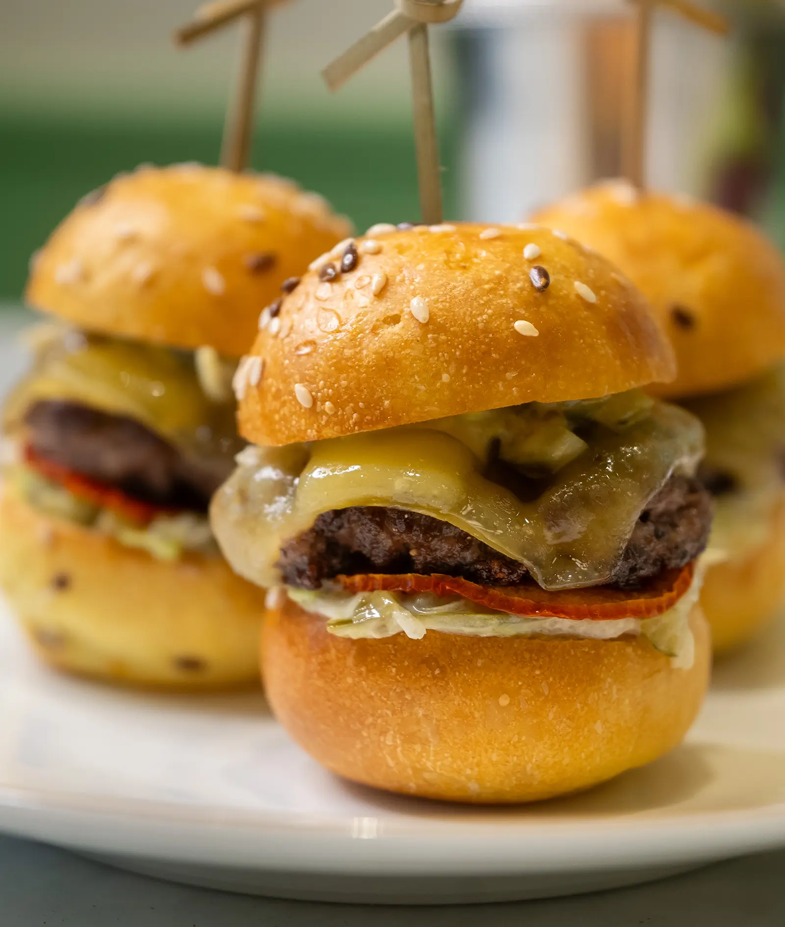 Beef sliders served with artisanal buns and sauce