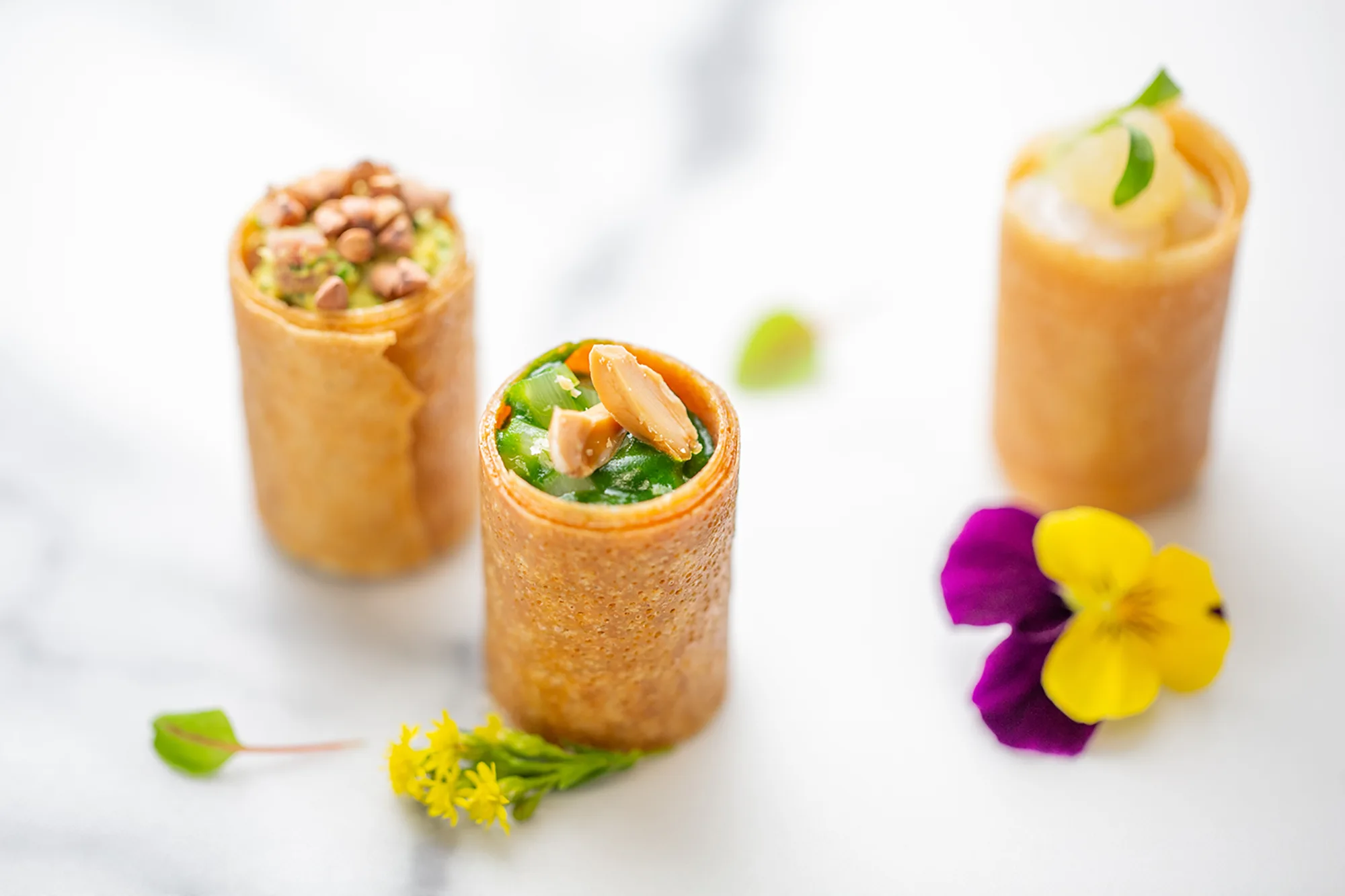 Elegant French catering setup by Ladurée with gourmet pastries and savory selections 1