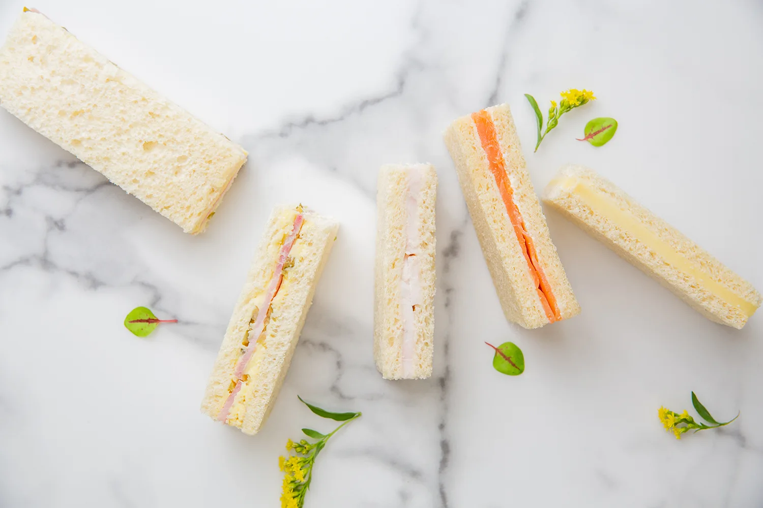 Elegant French catering setup by Ladurée with gourmet pastries and savory selections 2