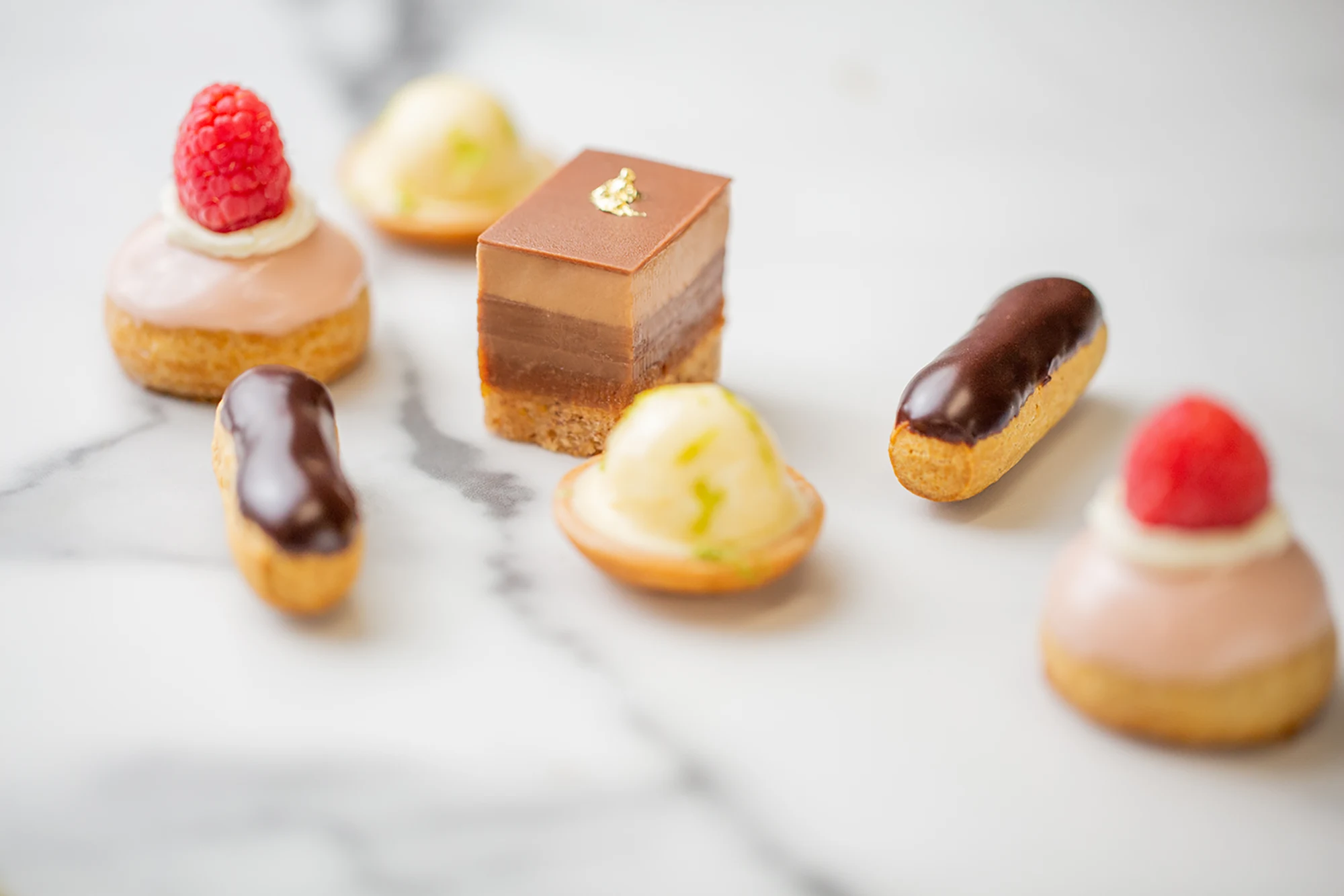 Elegant French catering setup by Ladurée with gourmet pastries and savory selections 4