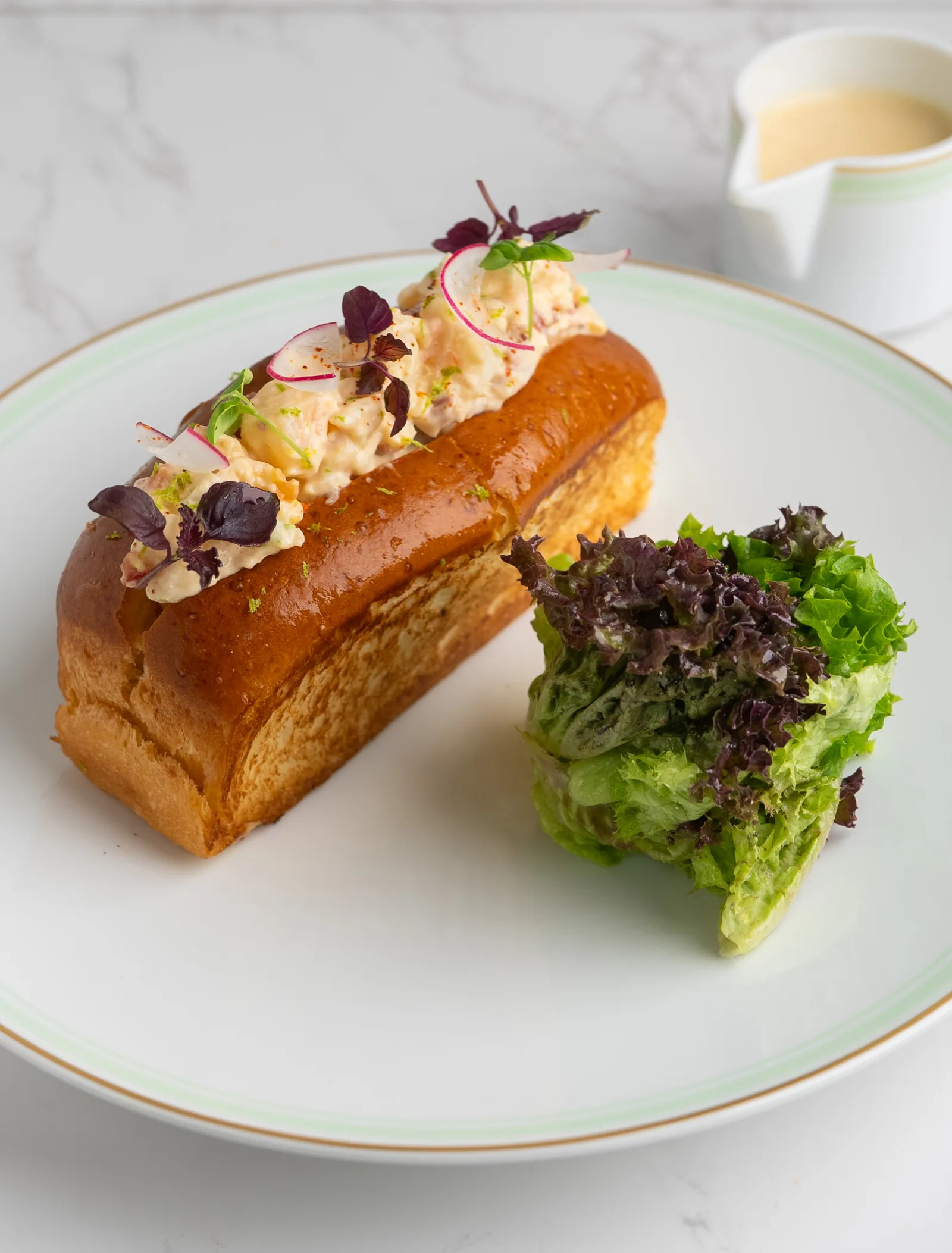 Lobster roll Ladurée with fries and salad